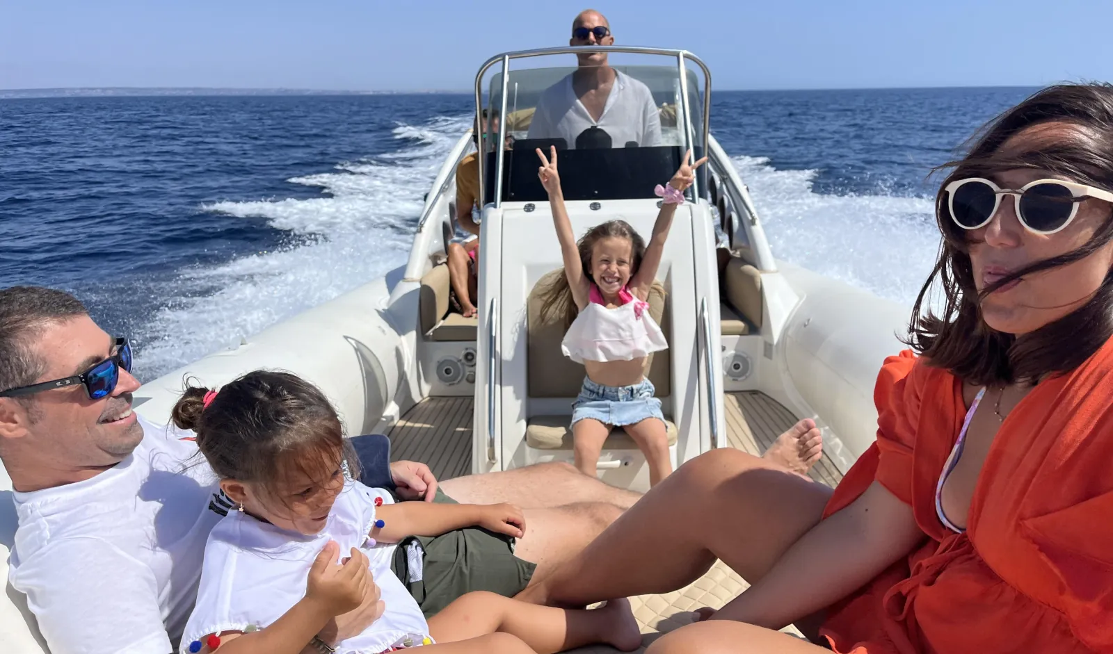 A family aboard the RIB during the crossing from Marsala