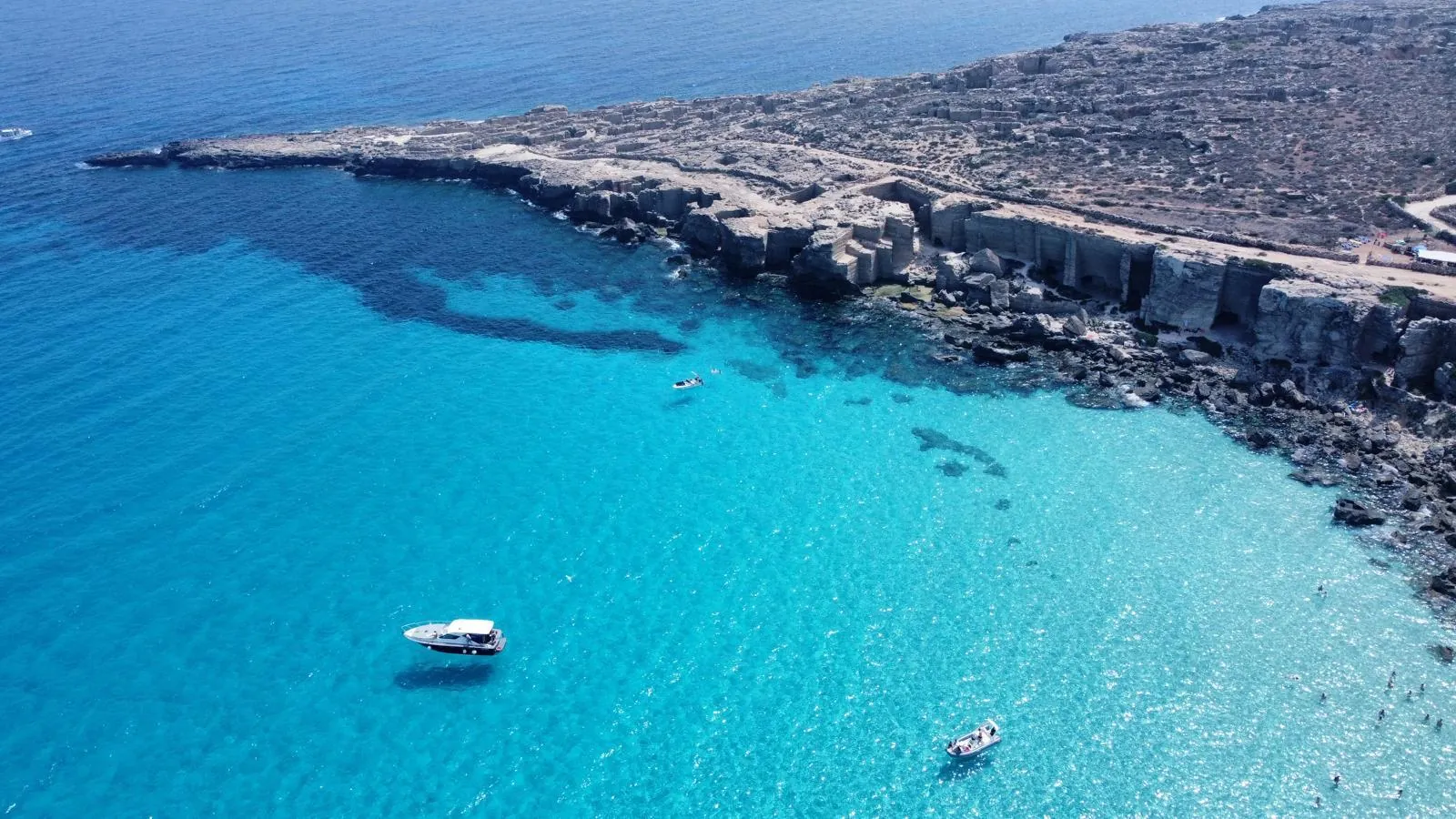 The Favignana headland from the air with boats anchored in the bay below