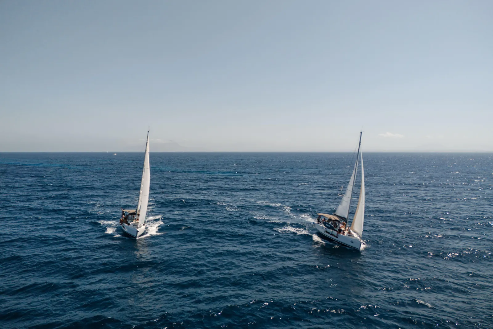 Two sailing yachts on open water off the Egadi Islands