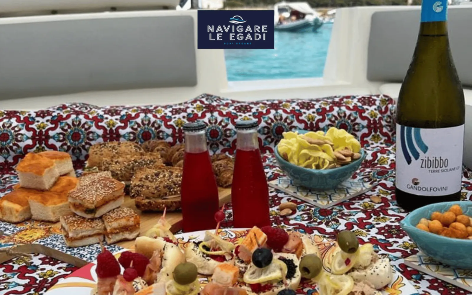 A Sicilian aperitif spread on board with the operating family's own bottle of Zibibbo