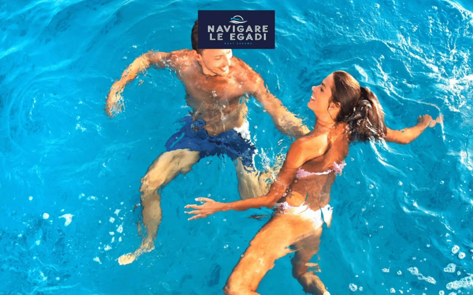 Two guests swimming together in bright blue water at a stop