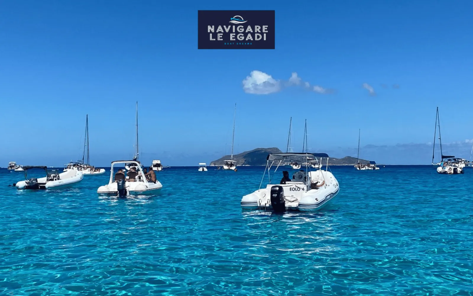 Boats at anchor off Favignana on a calm blue afternoon