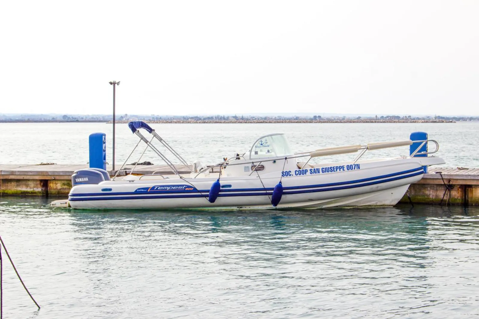 The operator's dinghy moored at the pontoon in Trapani marina